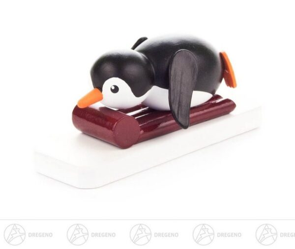 Dregeno Erzgebirge Sammelfigur Miniatur Pinguin Nichtschwimmer Breite x Höhe x Tiefe 6 cmx2,5 cmx2, Miniaturfigur Pinguin auf Schlitten